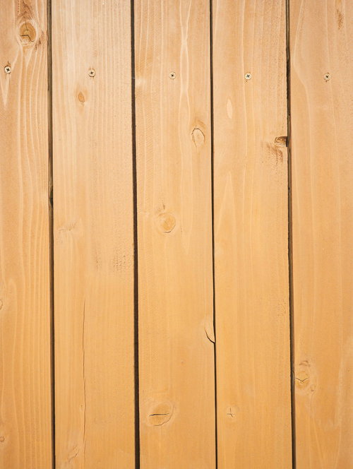 釘が打たれた綺麗な木目板のテクスチャー