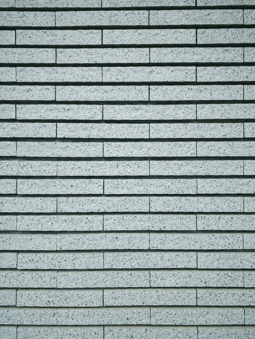 長方形の石タイル壁のテクスチャー