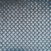 跡が残るチェッカープレートのテクスチャーの写真