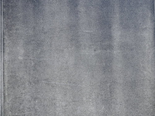 グレーのコンクリート壁の表面テクスチャー