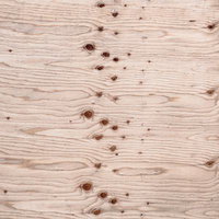 規則的に並ぶ節が特徴的な木材のテクスチャーの写真