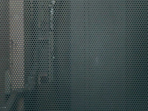 グレーのアルミパンチング板のテクスチャー