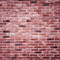 中心部分が白くかすれたレンガ壁のテクスチャーの写真