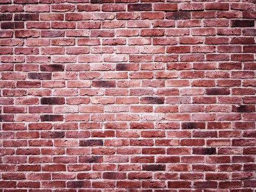 中心部分が白くかすれたレンガ壁のテクスチャー