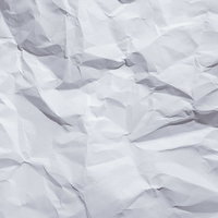 折り目としわが付いた白い紙のテクスチャーの写真