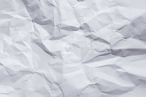 折り目としわが付いた白い紙のテクスチャー