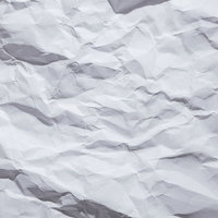 くしゃくしゃにされた白い紙のテクスチャーの写真
