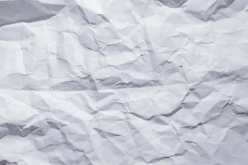 くしゃくしゃに折り目がついた白い紙のテクスチャー