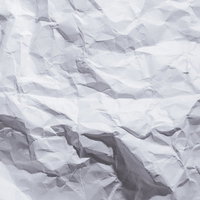 ポリゴン状のシワが立体的に入った紙のテクスチャーの写真