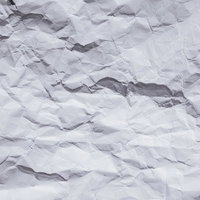 くしゃくしゃな白い紙のテクスチャーの写真