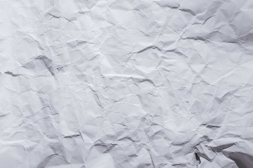 シワが多い白い紙のテクスチャー
