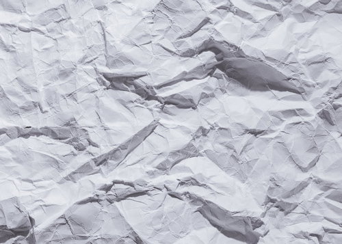 しわだらけの白い紙のテクスチャー