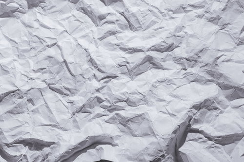 しわくちゃでくしゃくしゃの紙のテクスチャー