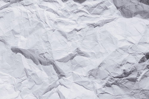 丸めた紙を広げた時のくしゃくしゃなシワと凹凸のテクスチャー