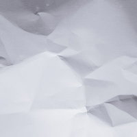 シワを付けた白い紙のテクスチャー背景の写真