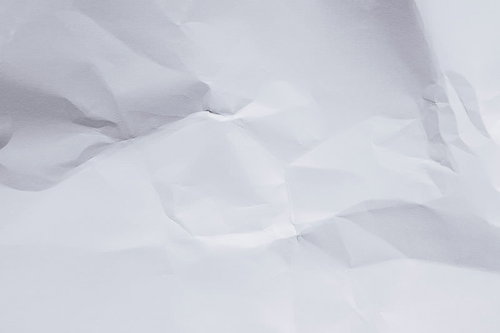 折り目が入ってしまった白い画用紙のテクスチャー