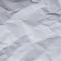 くしゃっと丸めてしまった白い紙のテクスチャーの写真