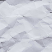 くしゃくしゃの紙のテクスチャー｜白い紙のシワの写真