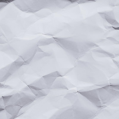 くしゃくしゃの紙のテクスチャー｜白い紙のシワの写真