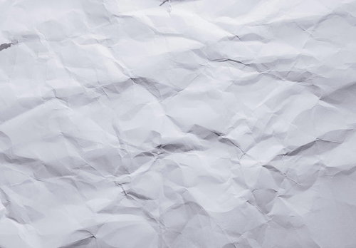 シワが目立つ白い紙のテクスチャー