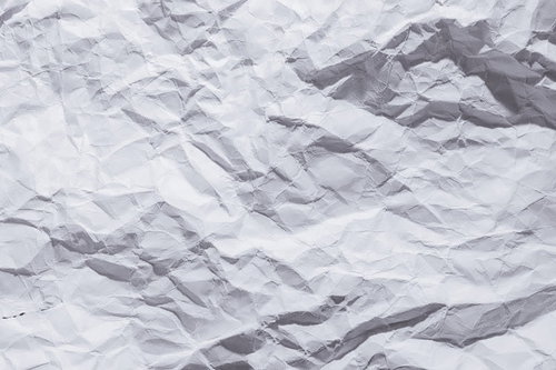 細かいシワが入った白い紙のテクスチャー背景