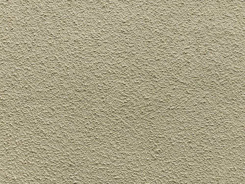 ベージュ色のモルタルで仕上げた外壁のテクスチャー