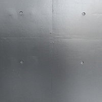 グレーに塗装したコンクリート壁の表面テクスチャーの写真