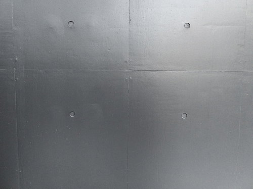 グレーに塗装したコンクリート壁の表面テクスチャー