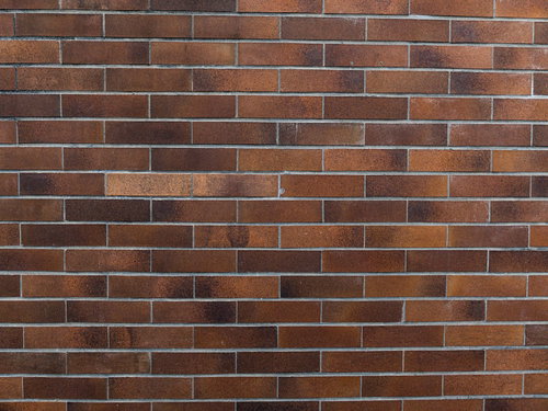 古びたレンガ調タイル壁のテクスチャー