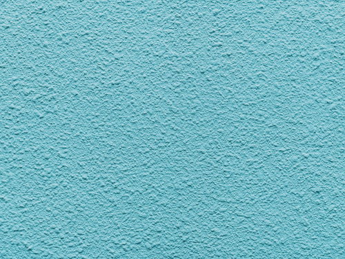 パステルカラーの水色モルタル壁のテクスチャー