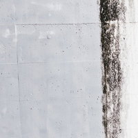 一部塗装済みのコンクリート壁のテクスチャーの写真