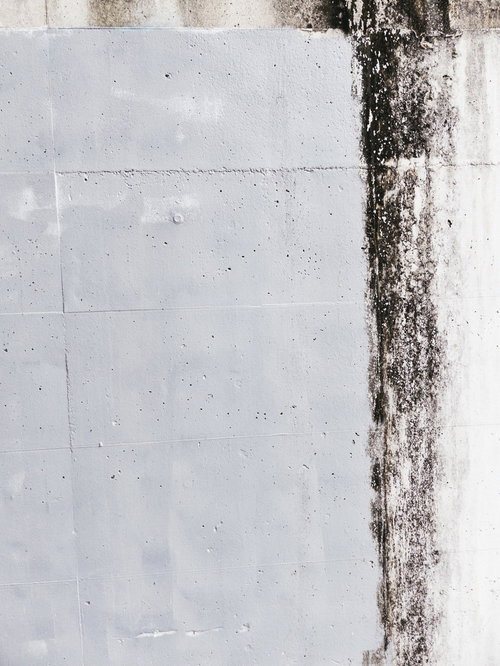 一部塗装済みのコンクリート壁のテクスチャー