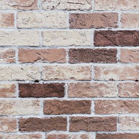 赤茶色と白色が交互に積み重ねられたレンガ壁のテクスチャーの写真