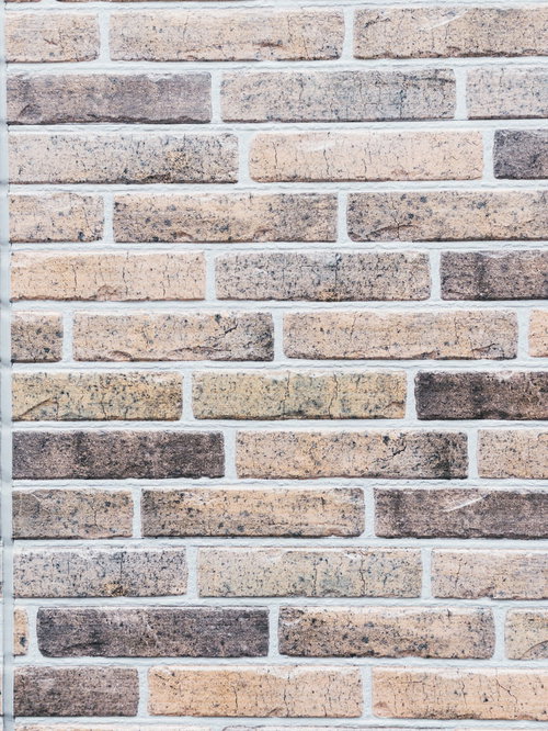 薄色のレンガ壁の煉瓦テクスチャー