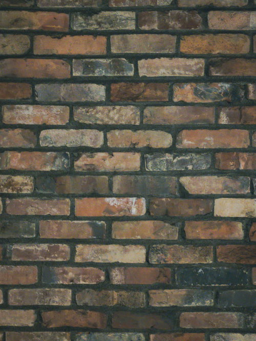 埋め込んだレンガの壁のテクスチャー