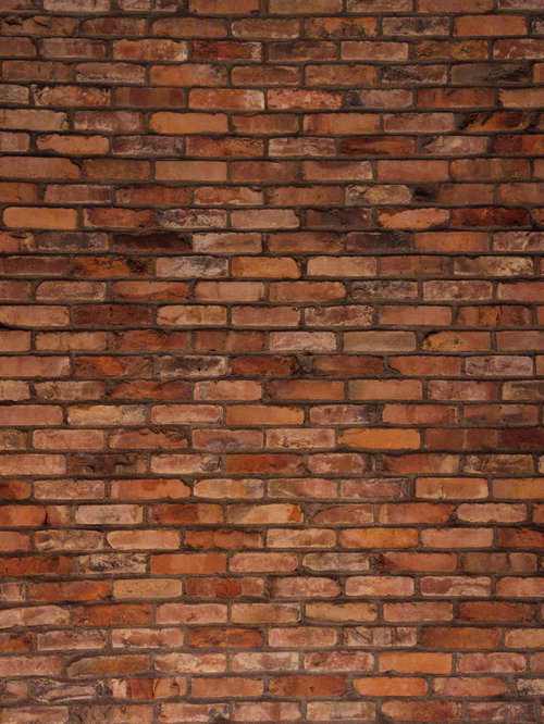 赤茶色から茶色まで積み上げたレンガ壁のテクスチャ
