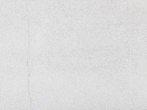 うっすらとひび割れた壁のテクスチャーと細かなクラック