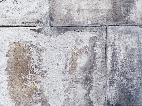白華現象の表れたコンクリート塀のテクスチャ