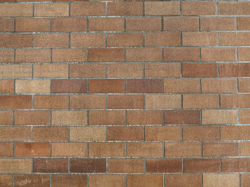 汚れと経年変化が見られるレンガ調壁のテクスチャー