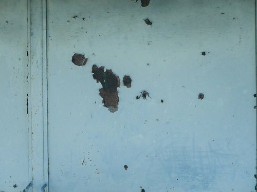 部分的にサビが浮いた壁のテクスチャ