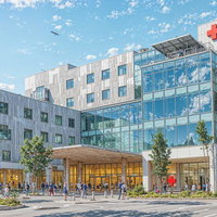 モダンな医療施設の外観と広場、白グレー基調の近代建築の写真