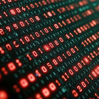 赤く光るデジタルコードとバイナリ数列のサイバー空間の写真