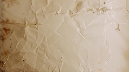 シワと汚れが付いた古紙のテクスチャー