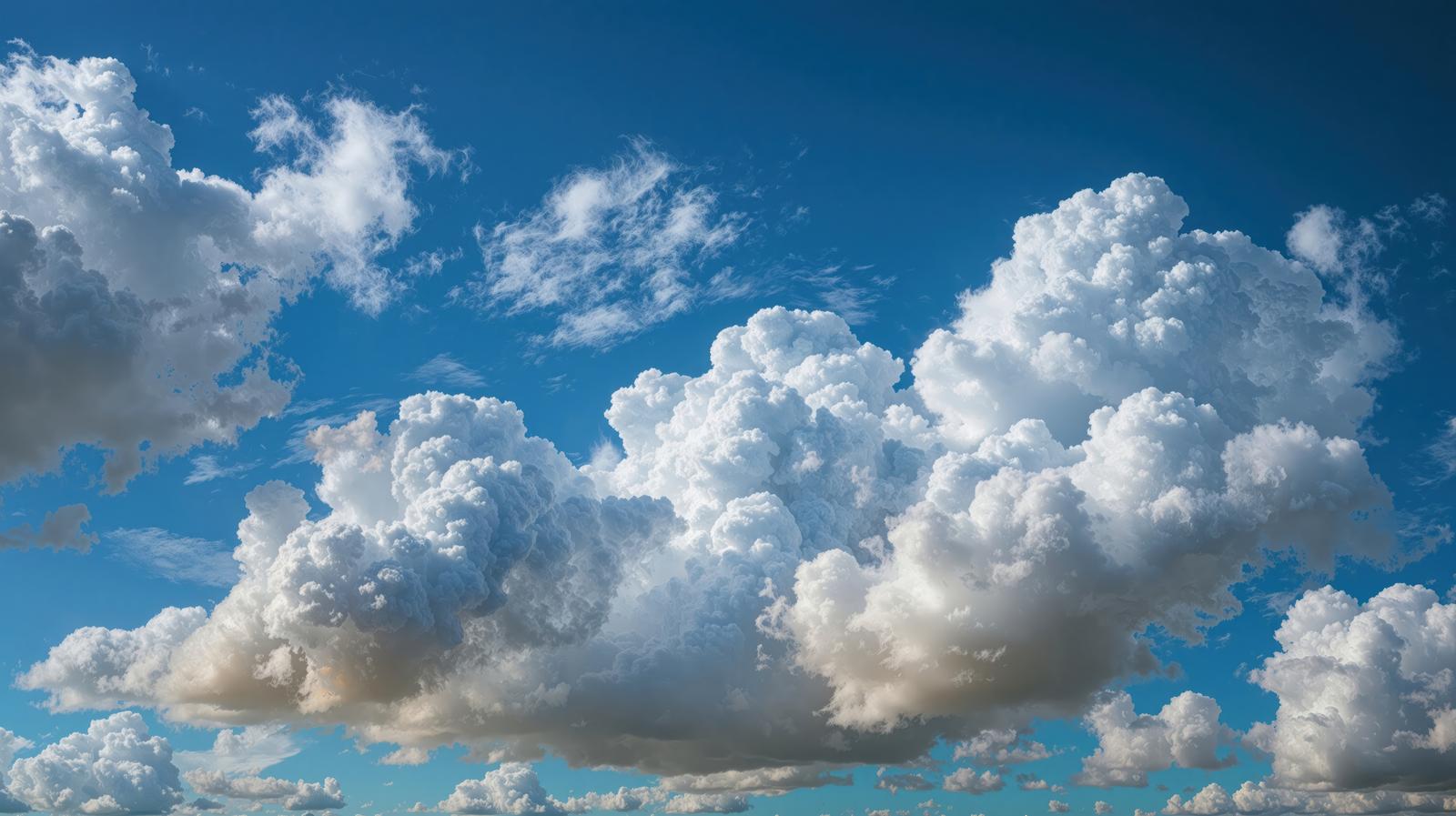 青空に大きく盛り上がる白い積乱雲のAI画像