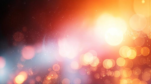 暖色の光粒が舞う玉ボケのキラキラした背景
