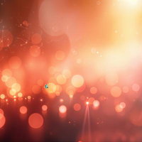 舞い踊るように散りばめられた大小の光の粒の写真