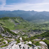 黒部五郎カーブから見る裏銀座方面の山並みの写真