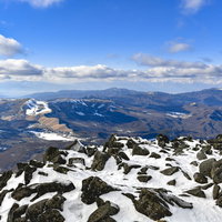 冬の蓼科山山頂から見る美ヶ原と山々の景色の写真