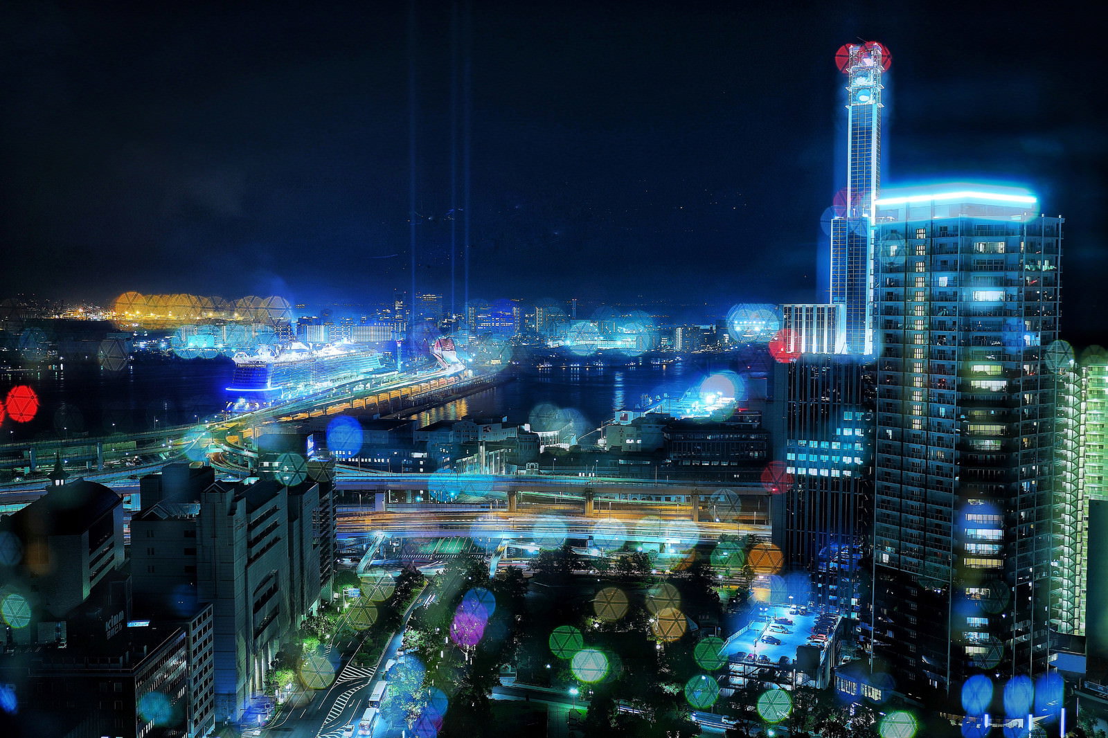 カラフルなネオンの光でライトアップされた都市の夜景