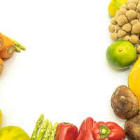 野菜に囲まれるフレーム（人参・椎茸・ミカン入り）の写真